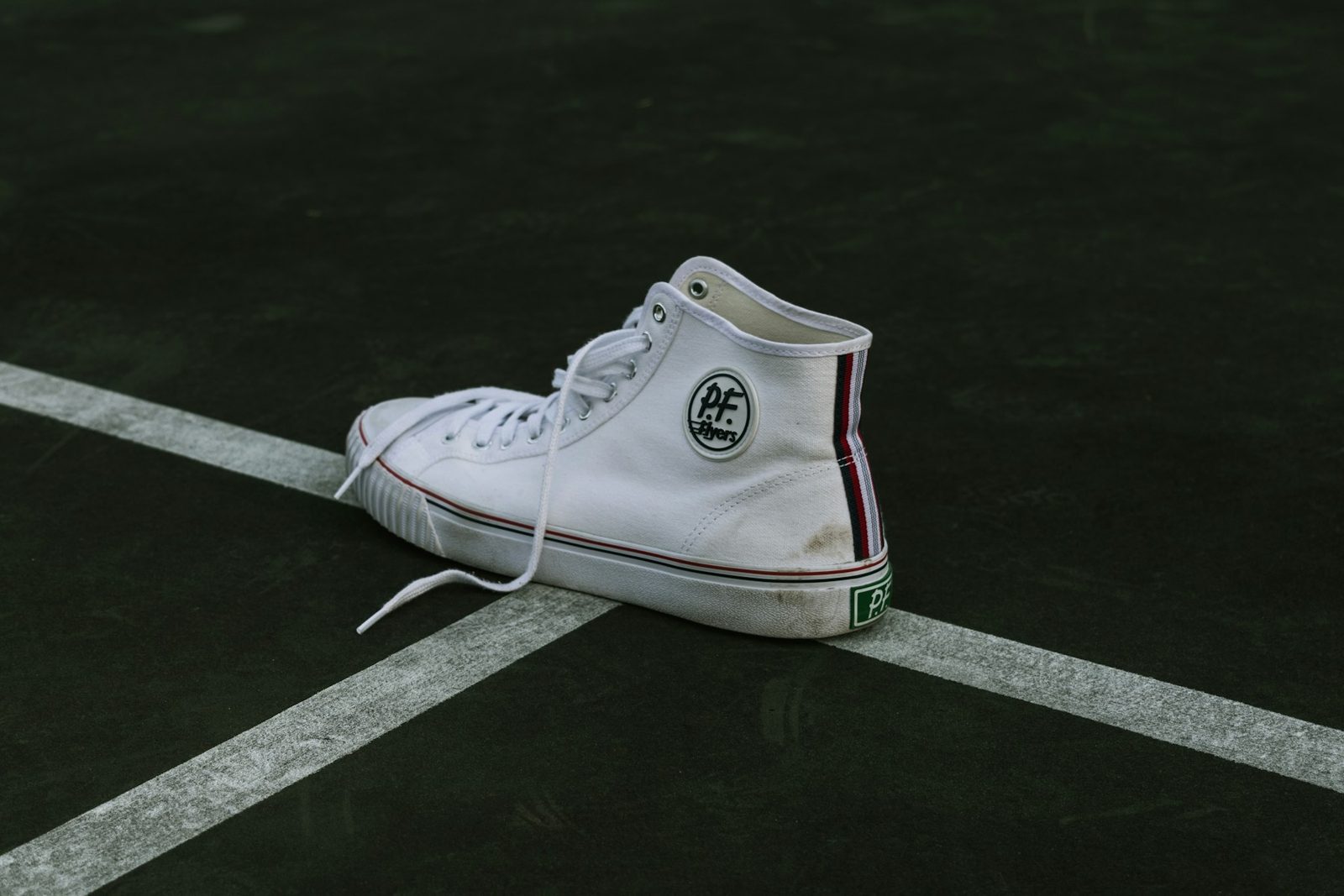 White high-top lace-up sports shoe