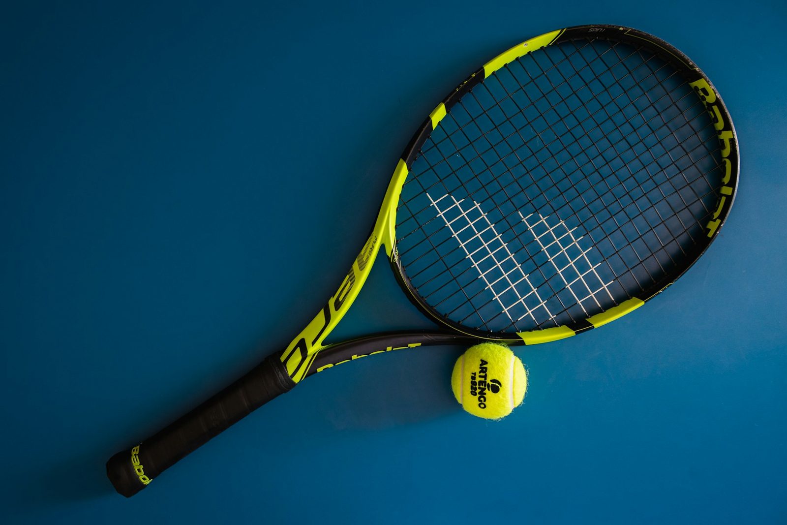 Black and white tennis racquet showing a clean string bed