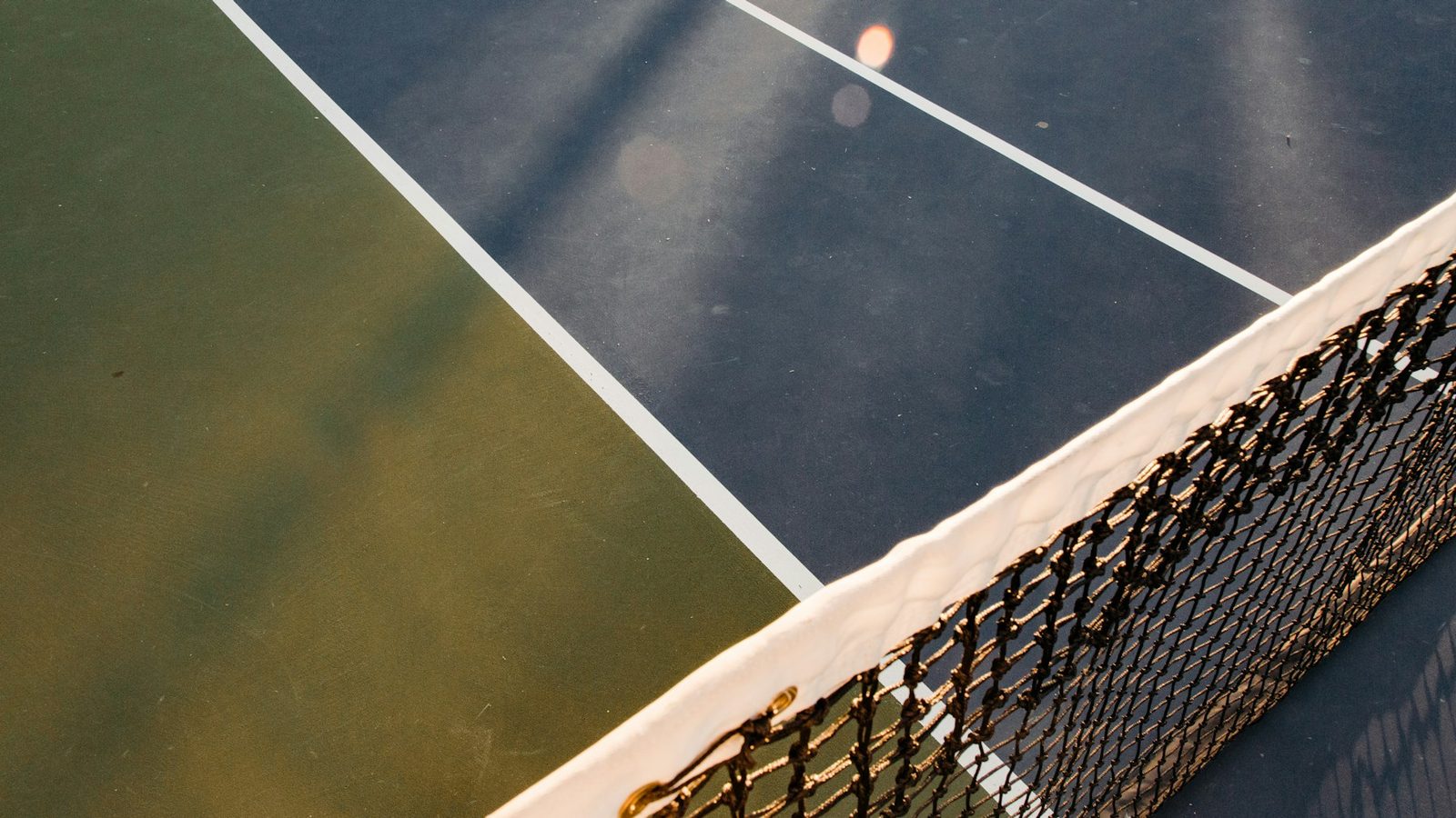 Close view of a white and black tennis net