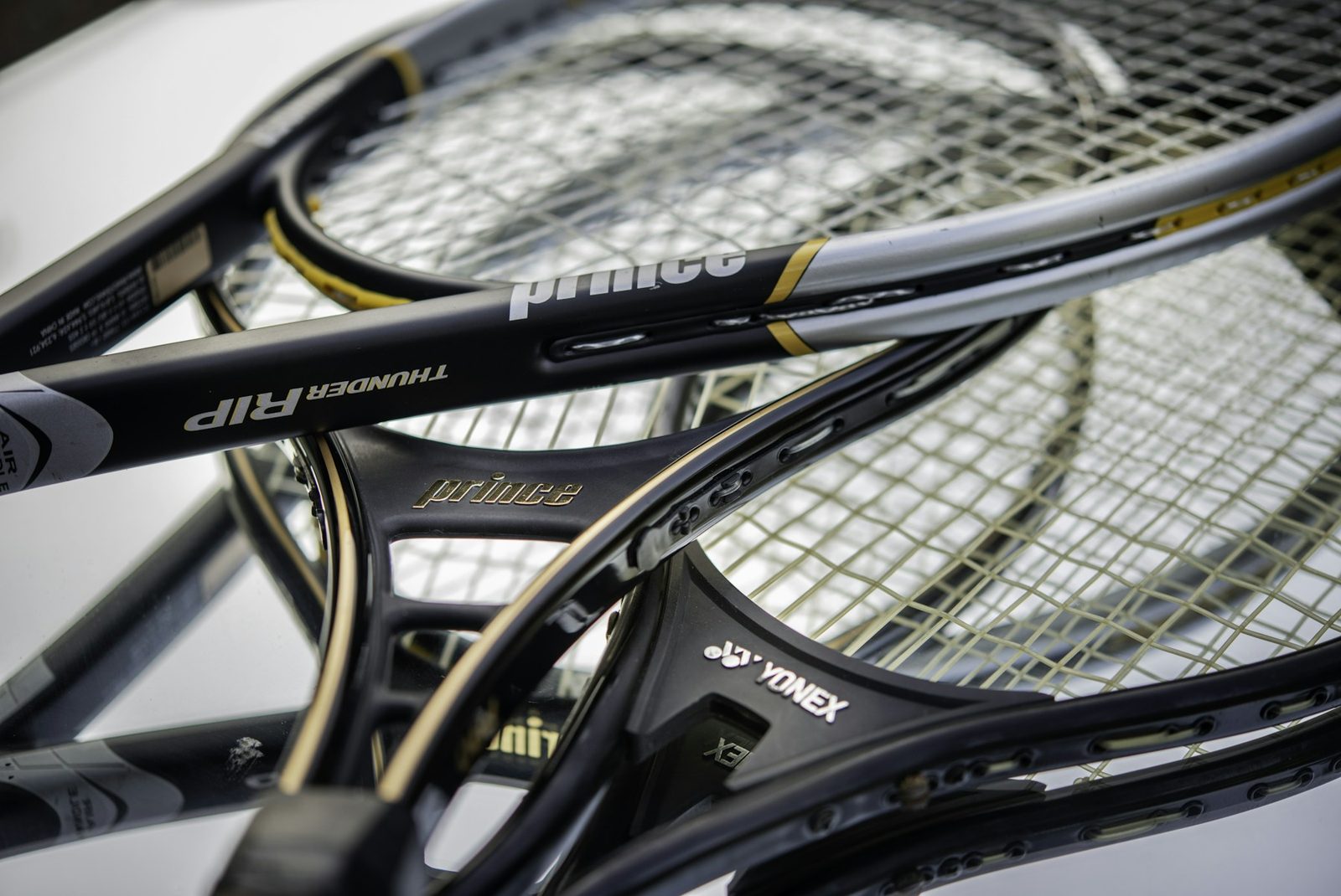 A black and yellow tennis racquet