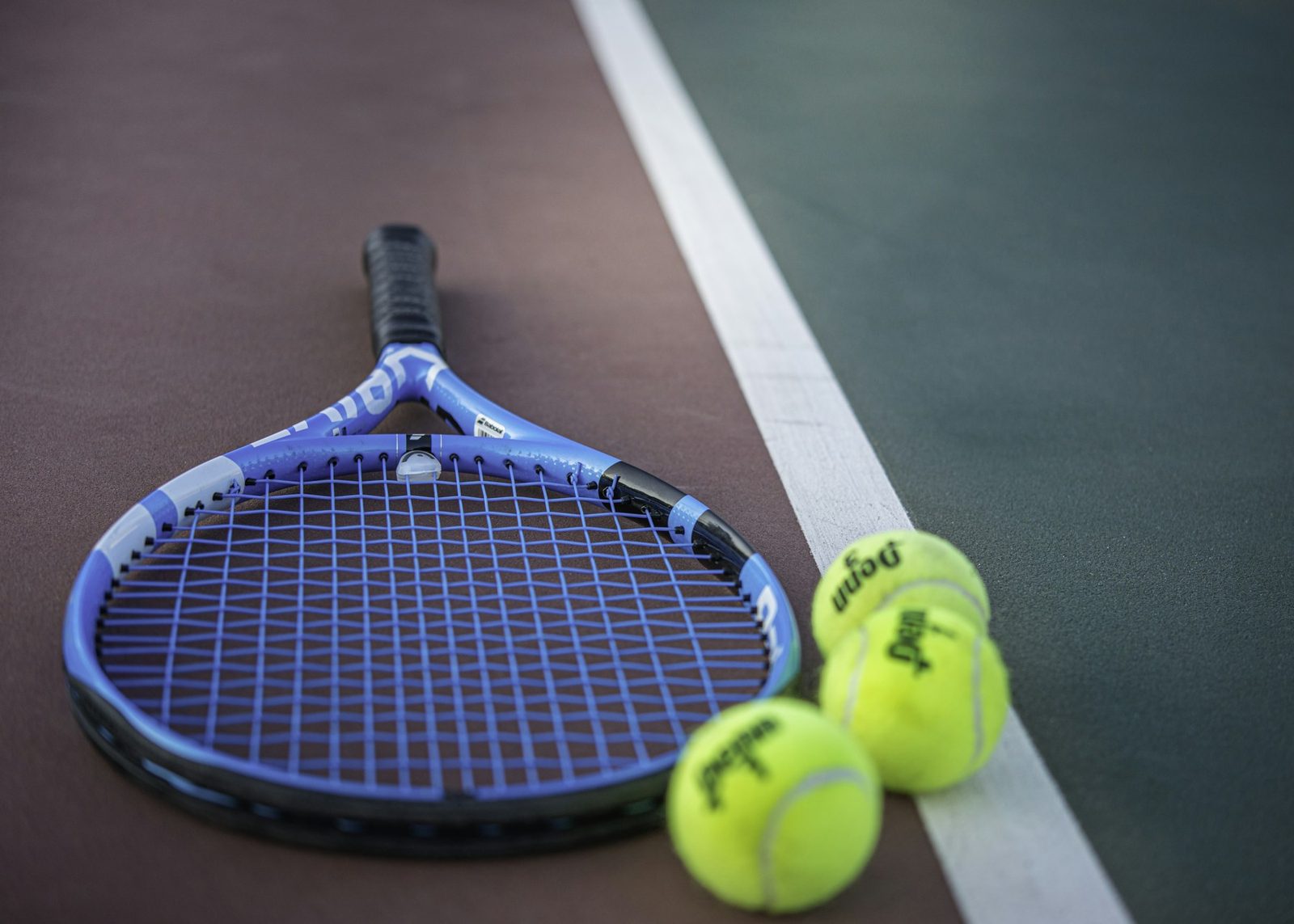 A yellow and blue tennis racquet