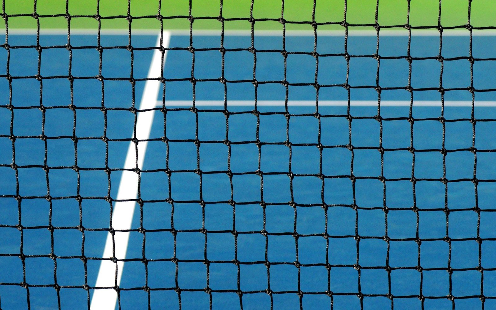 Close view of a tennis net and its white top band