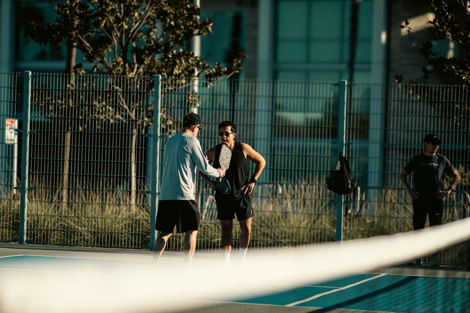Two players standing together on a tennis court