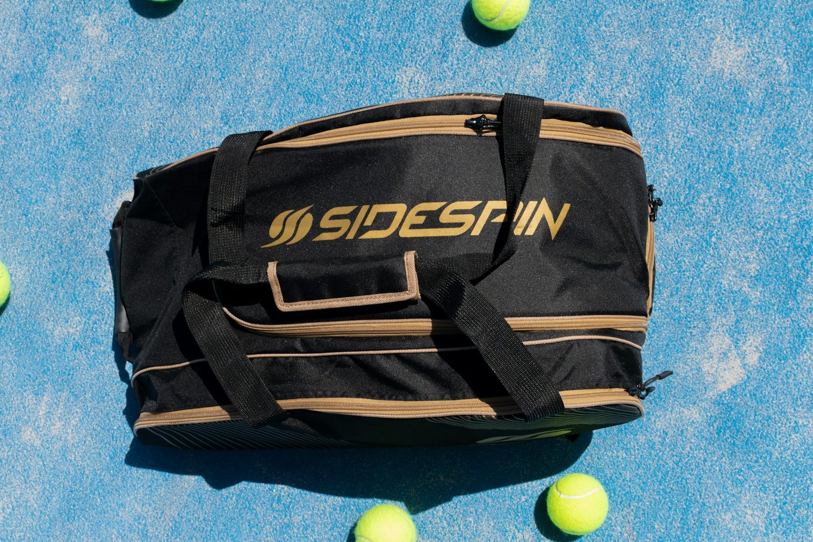 Tennis bag sitting on a court surface