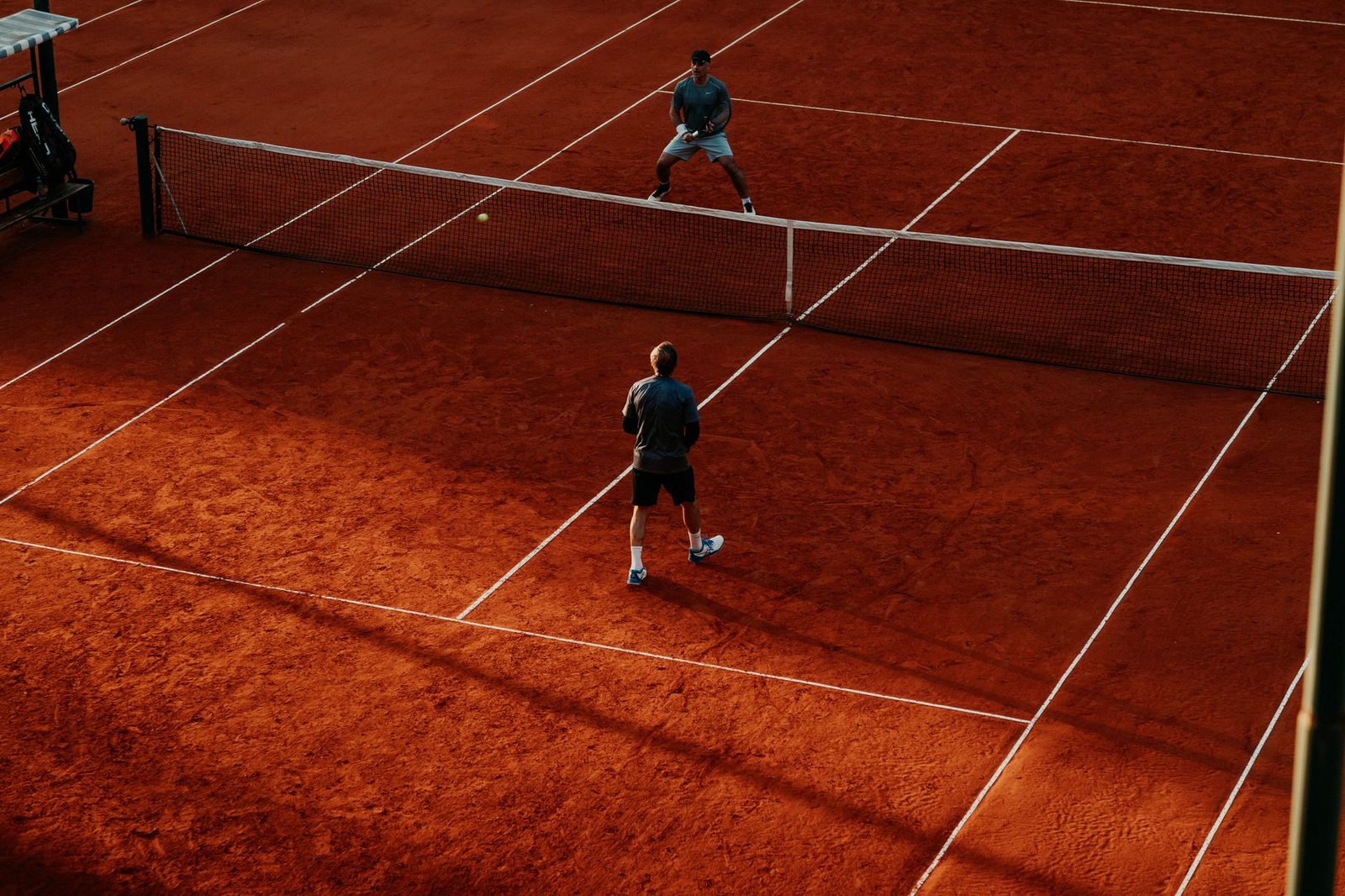 An intense tennis match in progress on a clay court