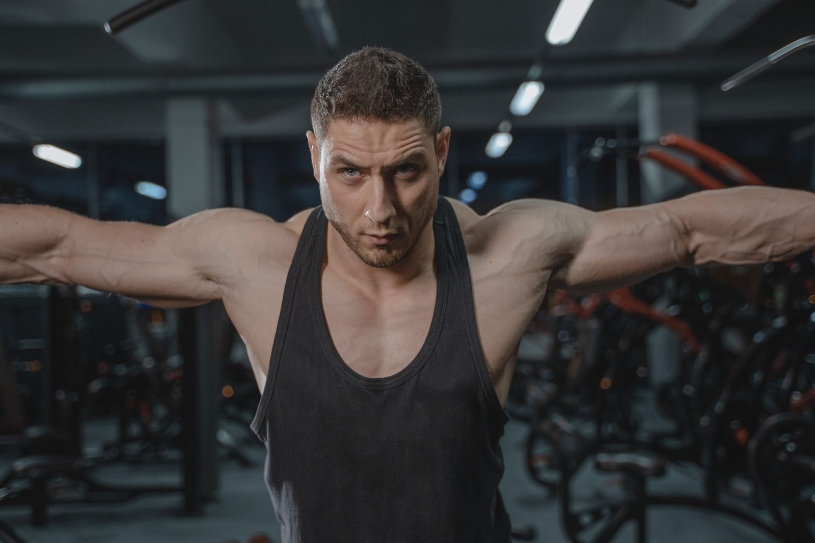 A man in activewear exercising in a gym