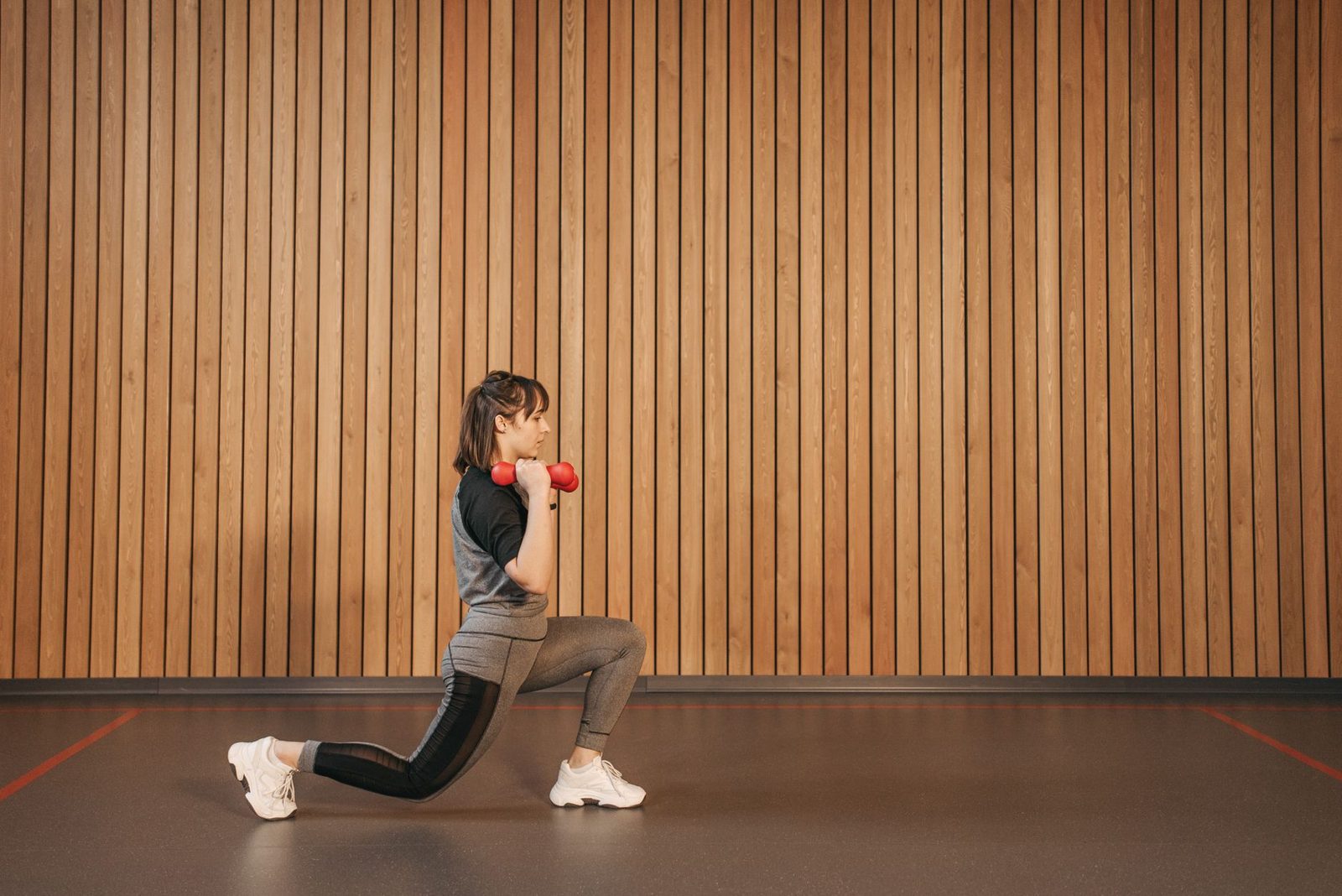 Woman exercising with dumbbells during a strength session