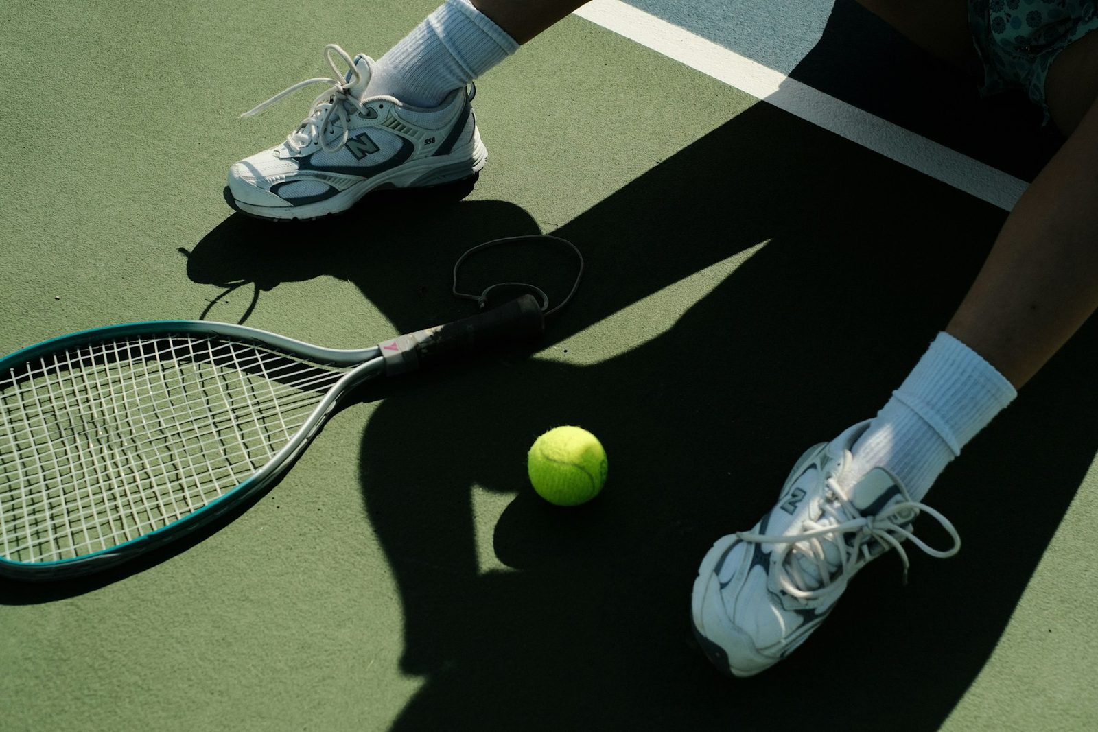 Player swinging a racquet at the ball while moving forward