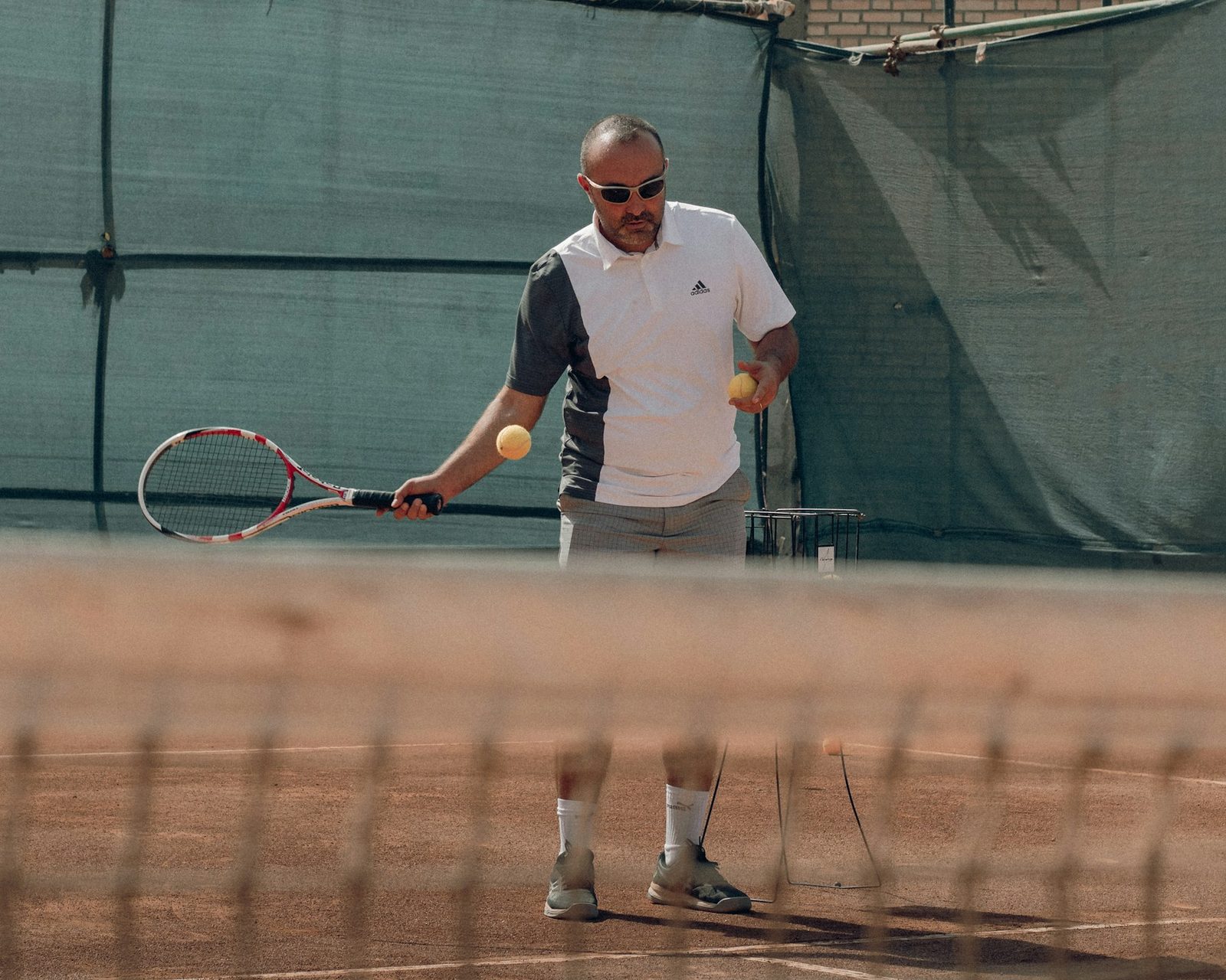 A man hitting a ball with a tennis racquet