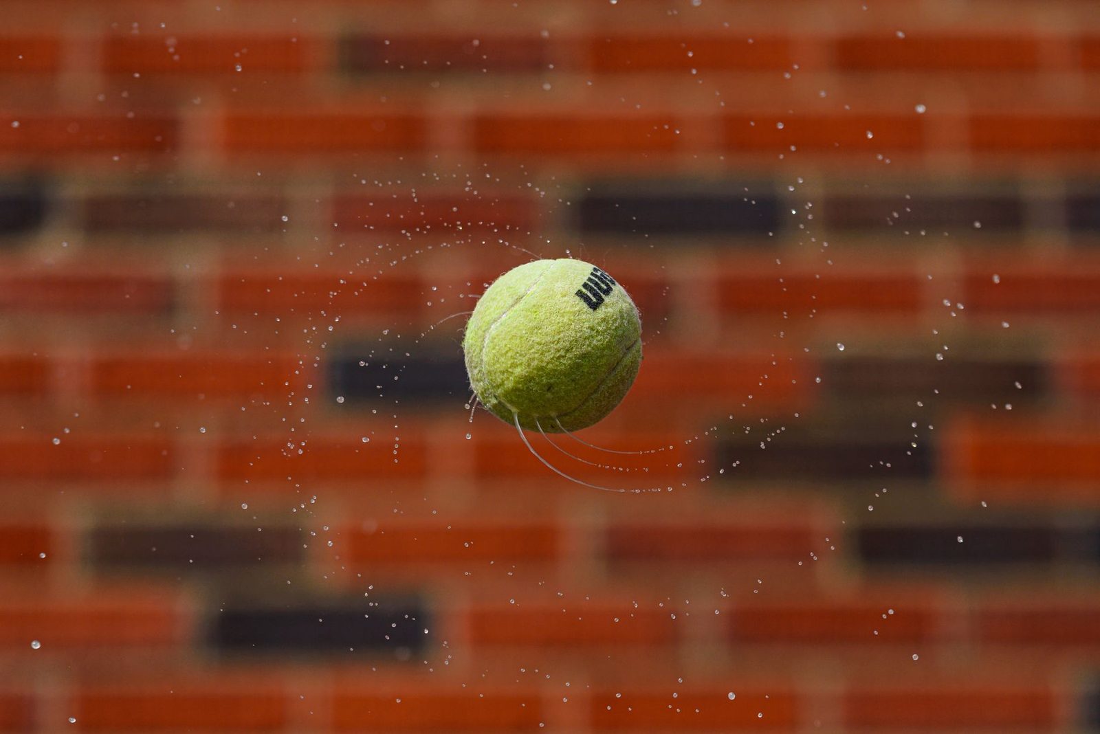 Tennis ball striking a brick wall, the basic setup behind every backboard drill
