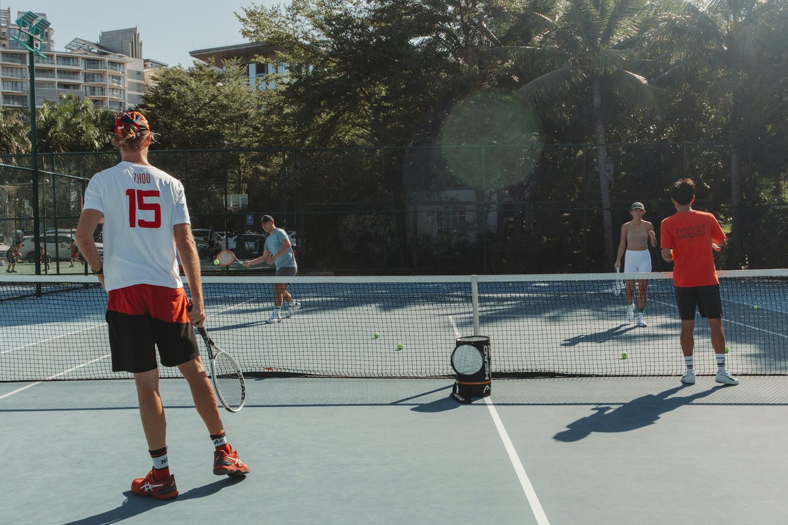A man standing on a tennis court holding a racquet