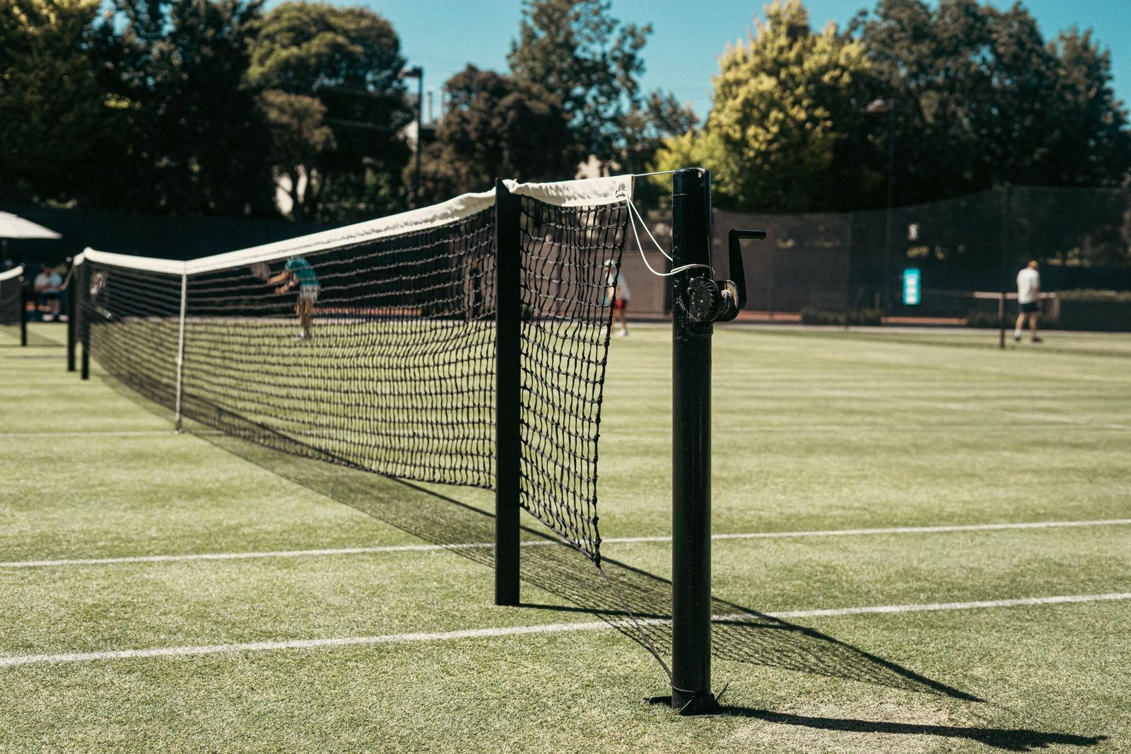 Grass tennis court with a net in a public park