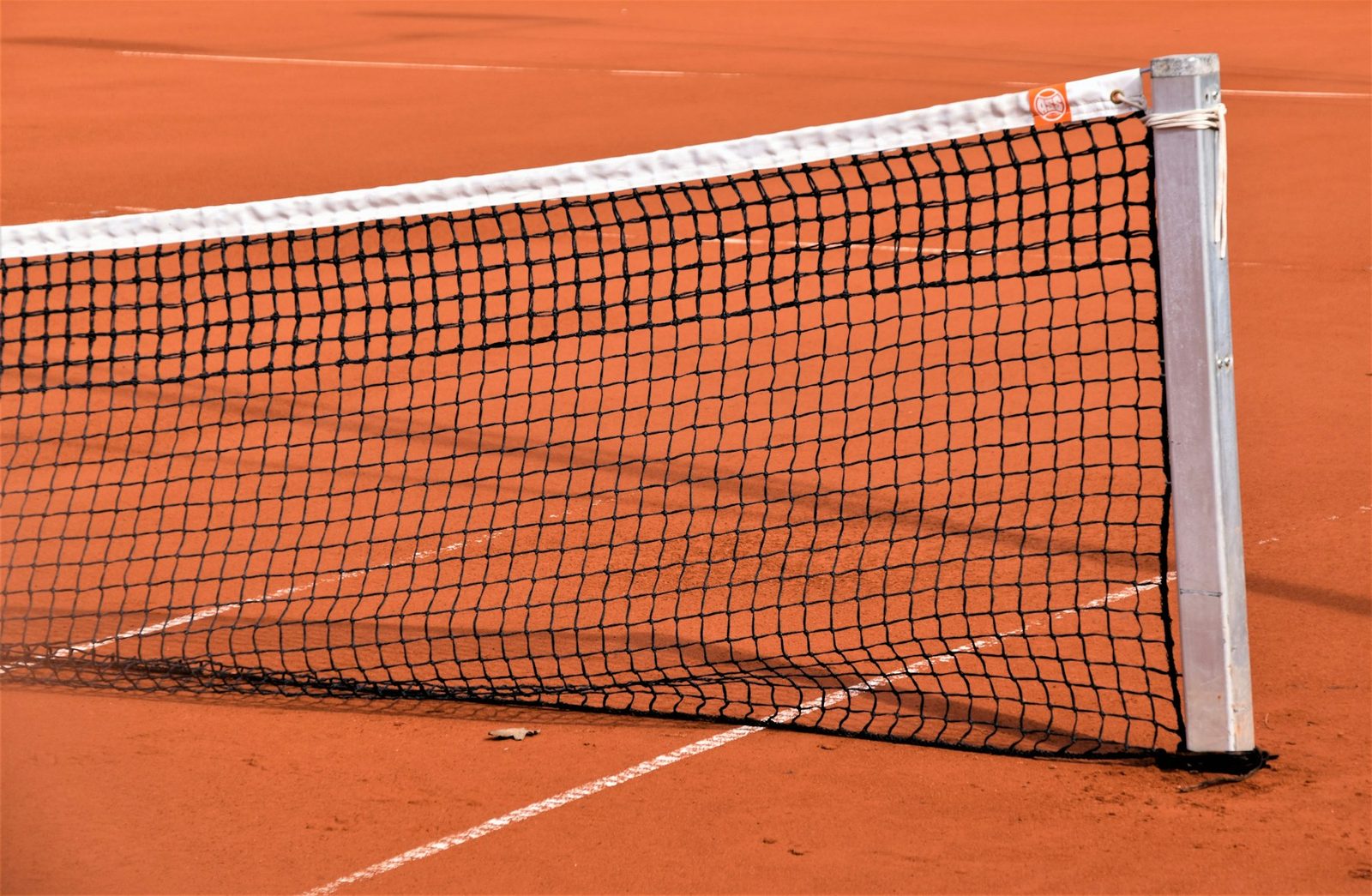Close view of a tennis net across the court