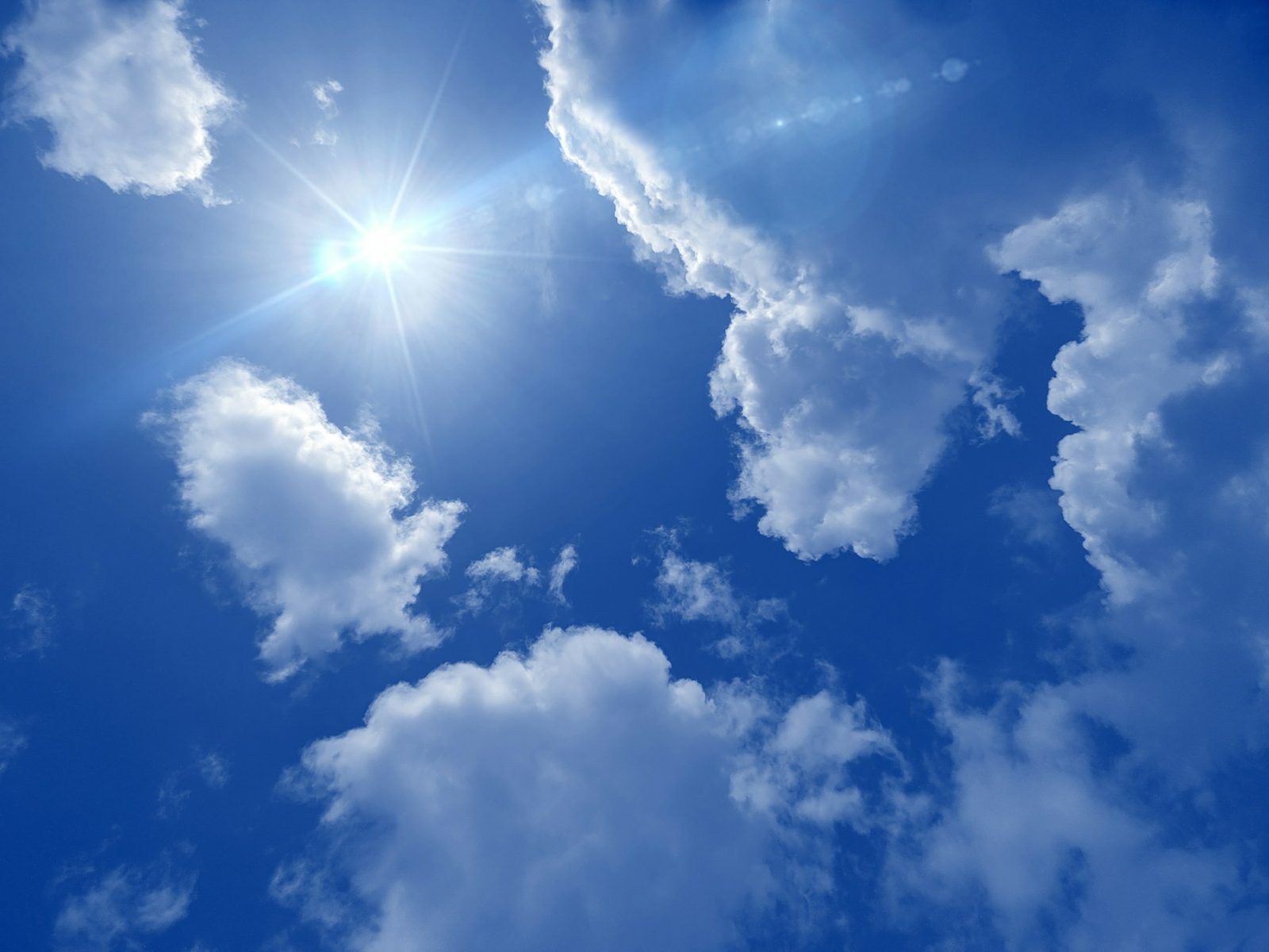 White clouds against a bright blue sky