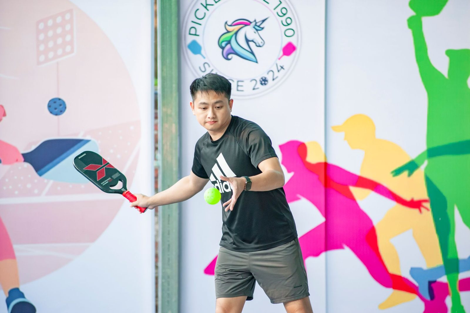 A pickleball player in action during a match