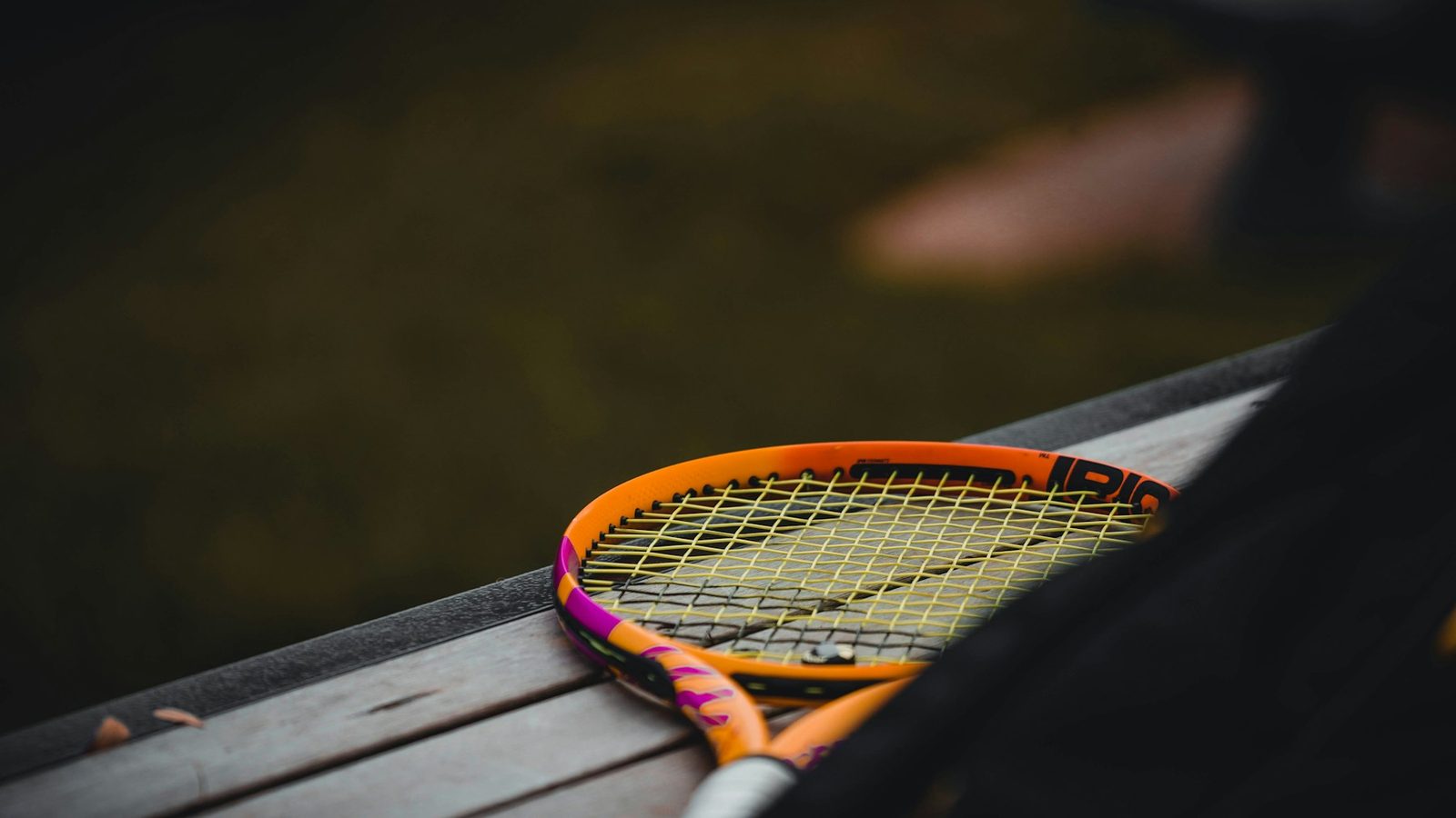A tennis racquet resting on a table